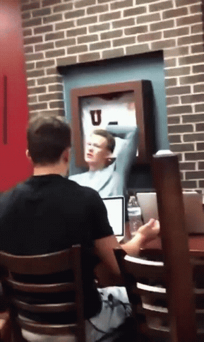 Man At Laptop With Arm Outstretched GIF