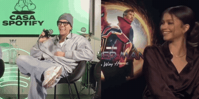 Man At Microphone Beside Spider-Man No Way Home Poster GIF