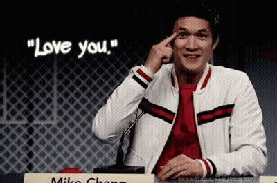 Man At Microphone Finger On Forehead Saying Love You GIF