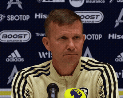 Man At Microphone In Front Of Sbotop Banner GIF