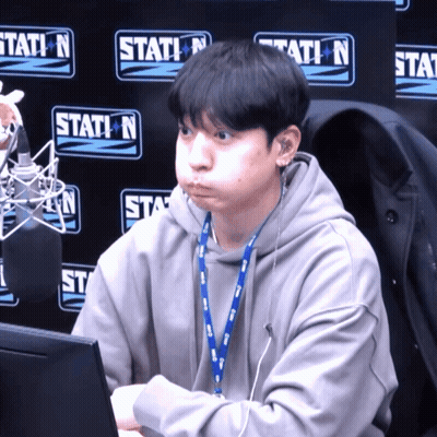 Man At Microphone In Front Of Station N Sign GIF