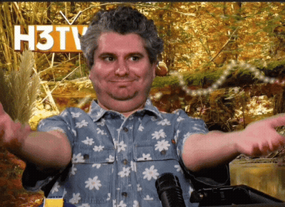 Man At Microphone In Front Of The Podcast Sign GIF