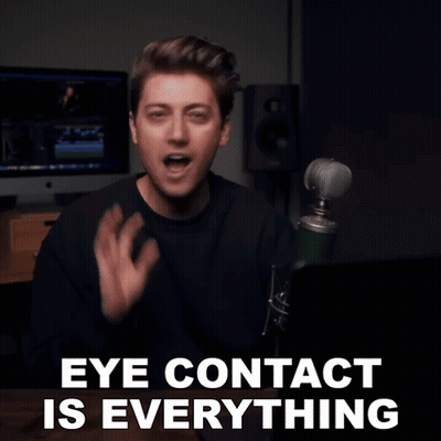 Man At Microphone Saying Eye Contact Is Everything GIF