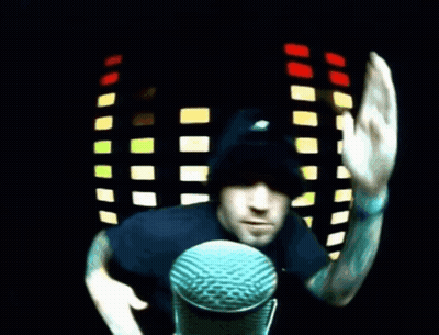 Man At Microphone Waving GIF