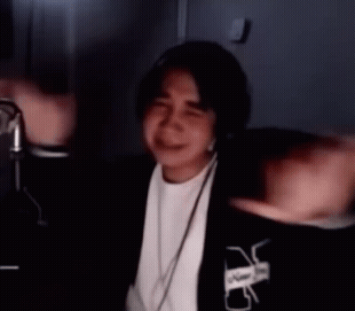 Man At Microphone With Arms Outstretched Blurry GIF
