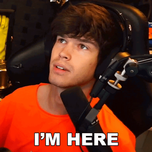 Man At Microphone With I'm Here Below GIF