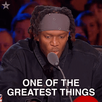 Man At Microphone With One Of The Greatest Things Above Him GIF