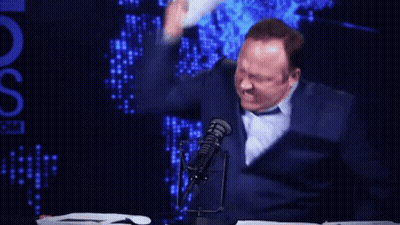Man At Microphone With Stack Of Papers And OS GIF