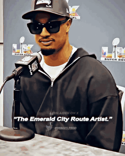 Man At Microphone With The Emerald City Route Artist GIF
