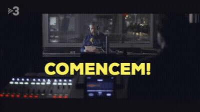 Man At Microphone With Yellow Comencem GIF