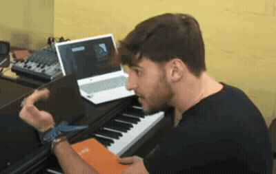 Man At Piano Looking At Laptop Saying Groove GIF