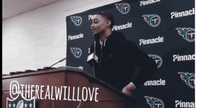 Man At Podium In Front Of Pinnacle Sign GIF