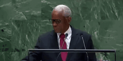 Man At Podium Saying AA GIF