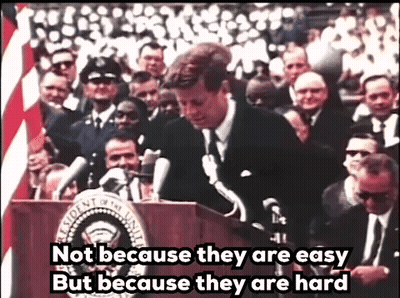 Man At Podium Saying Not Because They Are Easy But Because They Are Hard GIF
