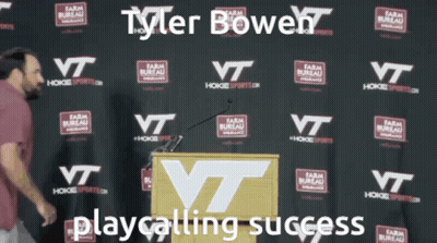 Man At Podium Tyler Bowen Playcalling Success GIF