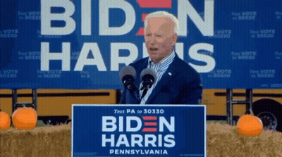 Man At Podium With Biden Harris Pennsylvania Sign GIF