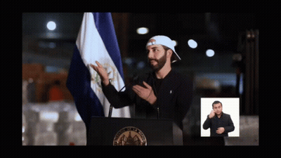 Man At Podium With Flag And Sign Language Sign GIF