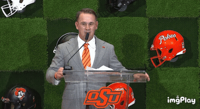 Man At Podium With Pokea Helmet GIF