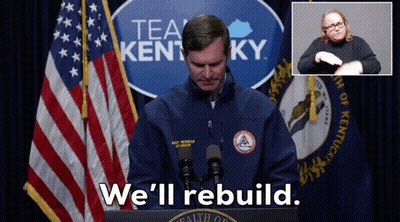 Man At Podium With Sign Saying Tea Kentucky We'll Rebuild GIF