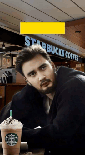 Man At Table In Front Of Starbucks GIF