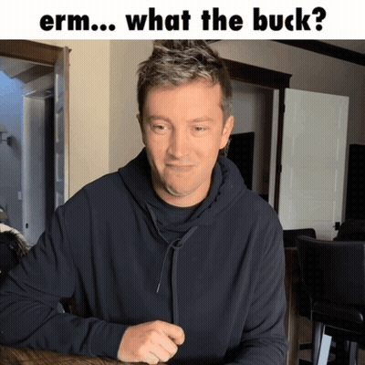 Man At Table Saying Erm What The Buck GIF
