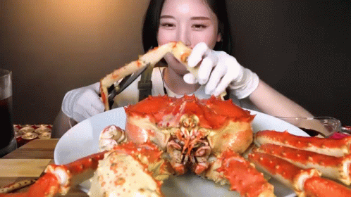 Man At Table With Crabs Saying Let's Eat GIF