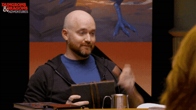 Man At Table With Dungeons & Dragons Screen GIF