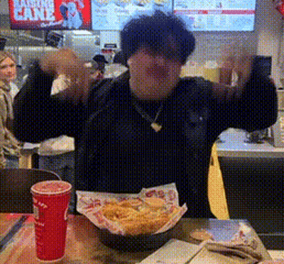 Man At Table With French Fries And Drink GIF