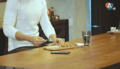 Man at Table with Glass of Water and Phone
