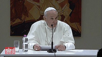 Man At Table With Microphone And News Water Bottle GIF