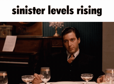 Man At Table With Wine Glasses Sinister Levels Rising GIF