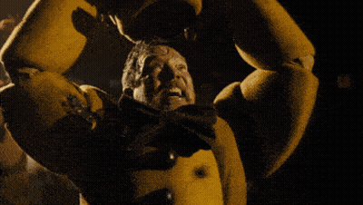 Man Attacked By Yellow Monster In Dark Room GIF