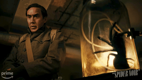 Man Before Glass Dome Spider Noir GIF