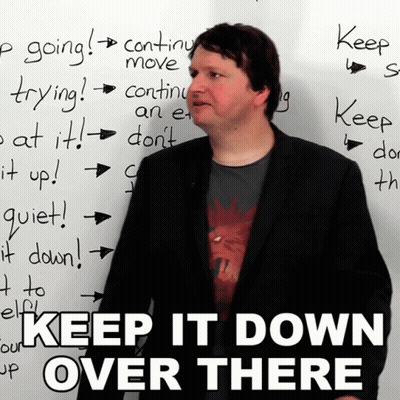 Man Before White Board Saying Keep It Down Over There GIF