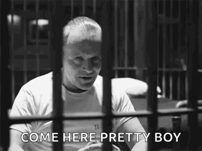 Man Behind Bars Talking GIF