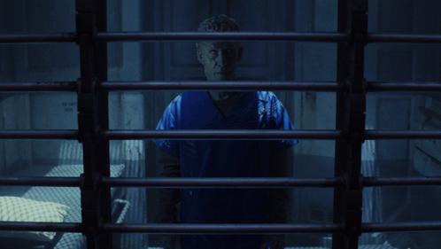 Man Behind Bars With It's Coming GIF