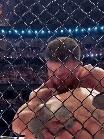 Man Behind Chain Link Fence In Boxing Match GIF