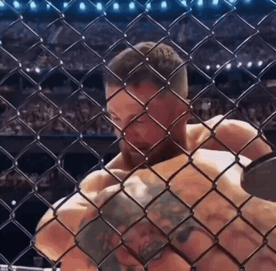 Man Behind Chain Link Fence In Cage GIF