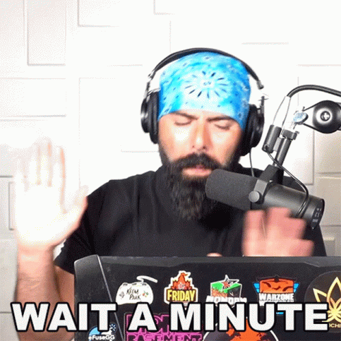 Man Behind Laptop Saying Wait A Minute GIF