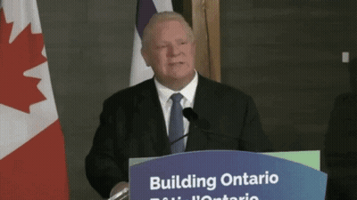 Man Behind Podium Saying Building Ontario GIF