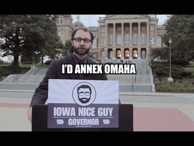 Man Behind Podium Saying Iowa Nice Guy Governor GIF