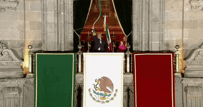 Man Behind Podium With Mexican Flag GIF
