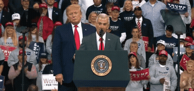 Man Behind Podium With US Seal GIF