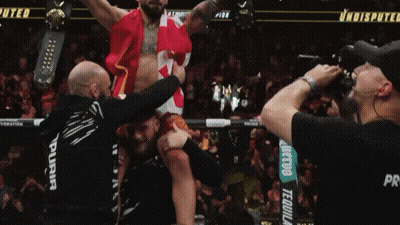 Man Being Lifted In Air With UFC GIF