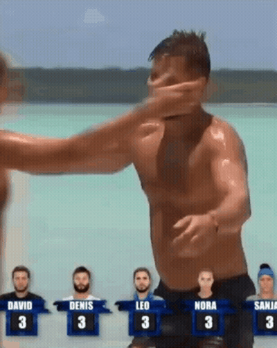 Man Being Punched In Face In Front Of Crowd GIF