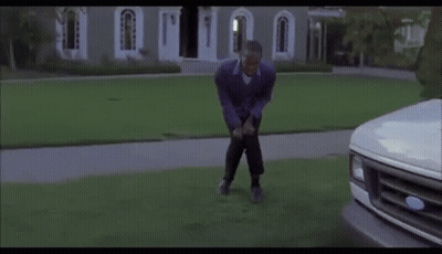 Man Bending Over In Front Of White Ford Truck GIF