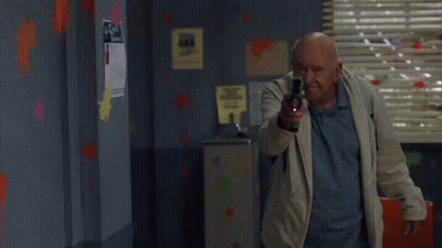 Man Beside Sports Sign GIF