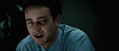 Man Black Eye Blue Shirt Making Face GIF