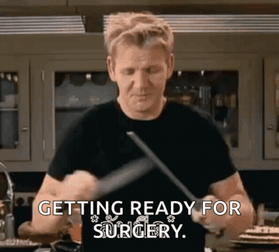 Man Black Shirt Holding Knife Spatula Getting Ready For Surgery GIF