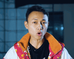 Man Blow Air In Front Of Camera GIF